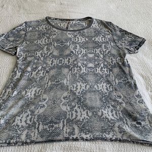 Free people T-shirt, has that worn look size medium